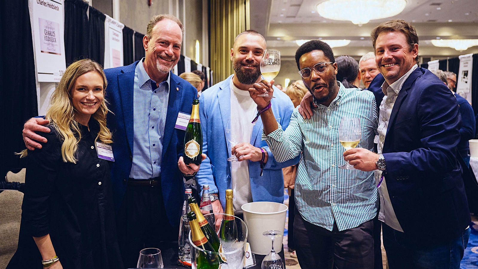  Katie German, Roger Ross, Kevin Hyde, Jacque Louie, Nate Fuller share a toast at the Wine Spectator Grand Tour in New Orleans.